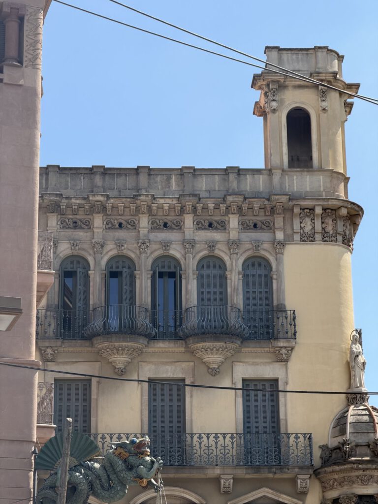 the exterior of an ornate historic building, likely an old European style apartment or...
