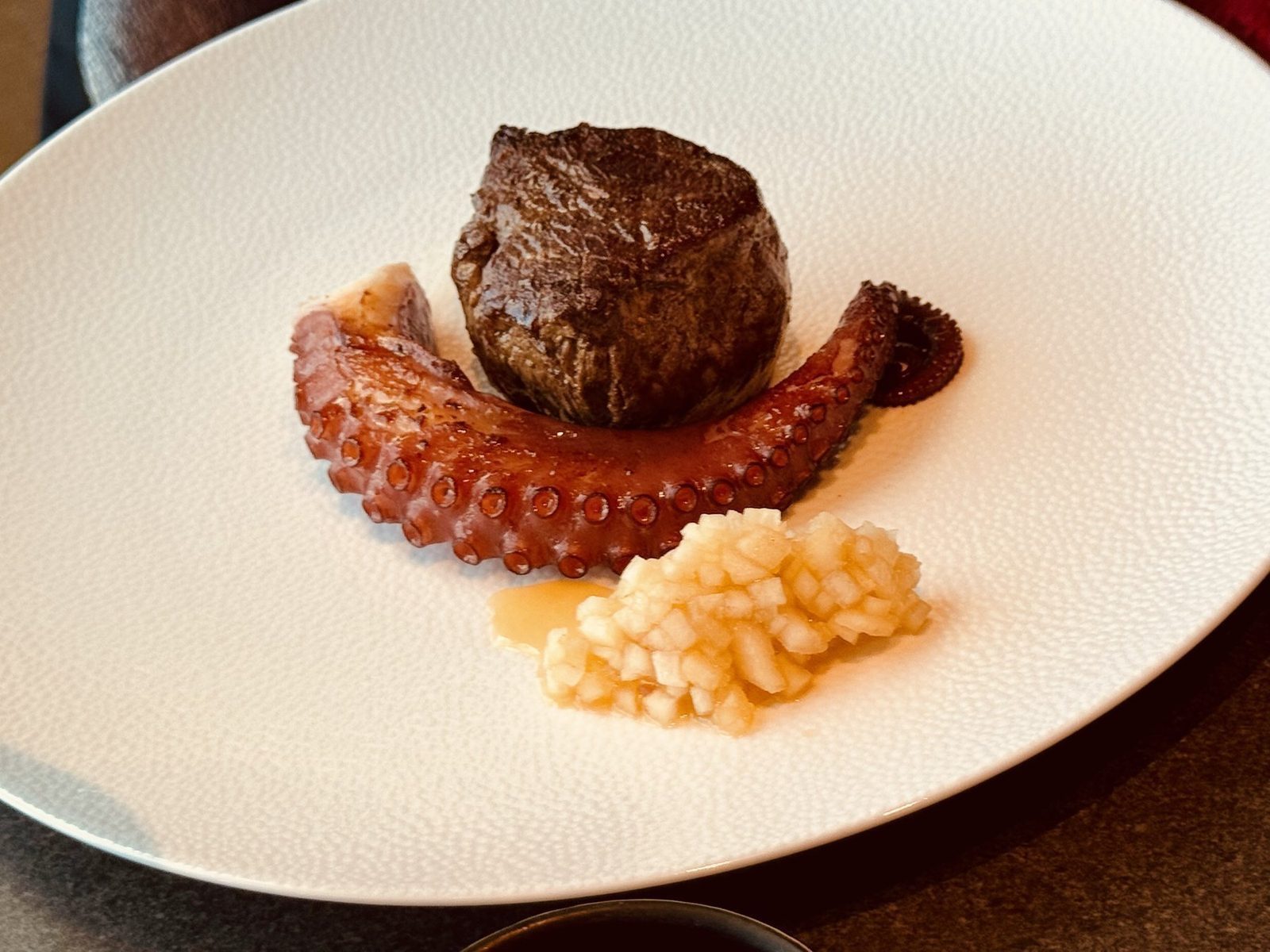 Steak mit Oktopus auf Risotto